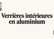 Cloison vitrée à cadre noir séparant un espace de bureau lumineux.